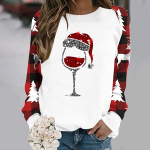 Detail of Christmas sweatshirt with sequins wine glass and buffalo plaid raglan sleeves