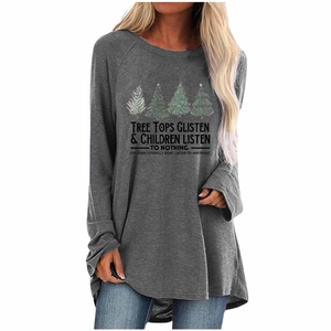 Close-up of Christmas tree prints and festive slogan on grey long sleeve shirt