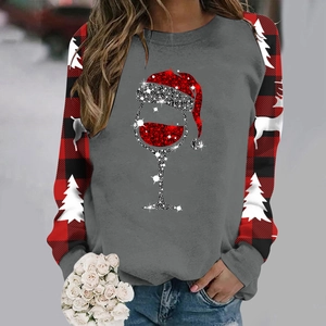 Detail view of raglan sleeve sweatshirt featuring buffalo check and Christmas wine glass print