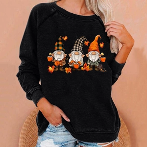 Detail of raglan sleeves and festive cartoon gnome prints on the black casual sweatshirt