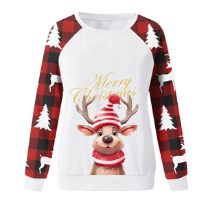 Detailed view of Christmas reindeer print and red plaid sleeves on white sweatshirt