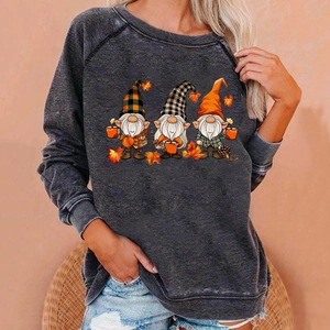 Detail of loose gray sweatshirt with autumn gnomes and maple leaf print for women