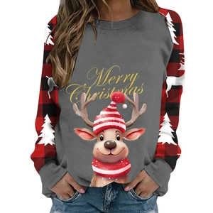Close-up of a festive Christmas sweatshirt with reindeer print and buffalo plaid raglan sleeves