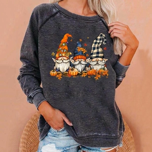 Detail of Halloween gnome print on a vintage dark grey oversized raglan sweatshirt