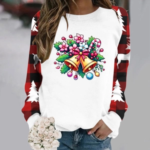 Detail of Christmas sweatshirt with festive prints and red black plaid raglan sleeves