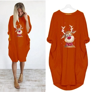 Detail of Christmas reindeer print on orange long sleeve dress with side pockets