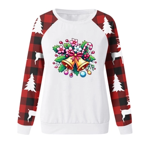 Detail of Christmas sweatshirt with festive prints and red black plaid raglan sleeves