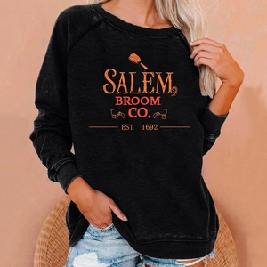 Detail of Salem Broom Co vintage print on a comfortable black raglan sleeve sweatshirt