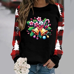 Detailed view of Christmas sweatshirt featuring festive bell print and plaid raglan sleeves