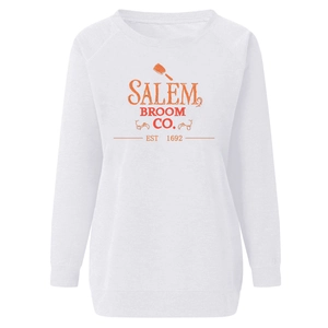 Close-up of Salem Broom Co. Halloween graphic print on white raglan sweatshirt