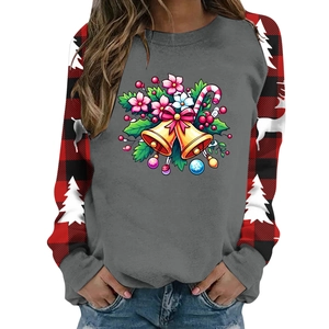 Close-up of Christmas sweatshirt showing gray body and red buffalo plaid raglan sleeves