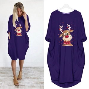 Detail of Christmas reindeer print on dark purple long sleeve dress with side pockets