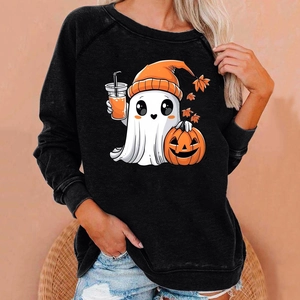 Detailed view of Halloween ghost and pumpkin print on a black raglan sweatshirt fabric