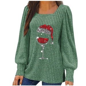 Green long sleeve rib-knit Christmas top featuring a festive wine glass graphic design