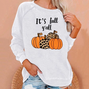 Close-up of Halloween sweatshirt showing pumpkins and It's fall y'all text on grey fabric