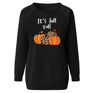 Detail of Halloween pumpkin print and 'It's fall y'all' text on black raglan sweatshirt