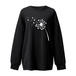 Detail of loose-fit black sweatshirt with heart dandelion print and ribbed cuffs