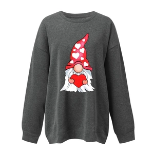 Detailed close-up of charcoal grey sweatshirt fabric and hand-drawn gnome heart print