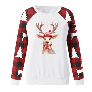 Close-up of Christmas reindeer print and red buffalo plaid sleeves on white sweatshirt