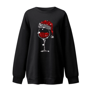 Detail of red and white glitter wine glass print on black Christmas sweatshirt
