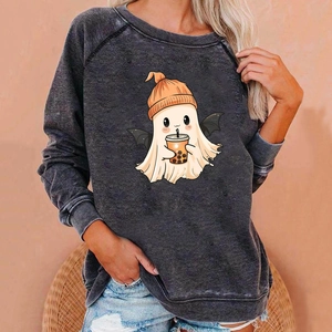 Close-up of Halloween ghost print with boba tea on a charcoal grey oversized sweatshirt