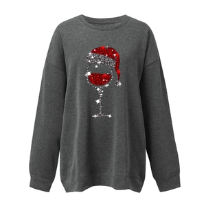 Detailed view of the Christmas wine glass print with red and silver glitter sequins