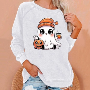 Close-up of Halloween sweatshirt showing cute ghost and pumpkin print on soft white fabric