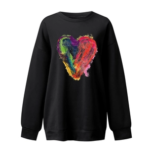 Detailed close-up of colorful graffiti heart print on black crewneck sweatshirt