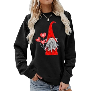 Close-up of heart print and gnome with balloons on black long sleeve sweatshirt