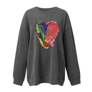 Close-up of colorful graffiti heart print on dark grey crewneck sweatshirt fabric