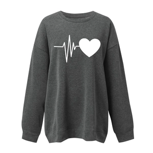 Detail of charcoal grey sweatshirt featuring white heart and heartbeat pulse graphic print