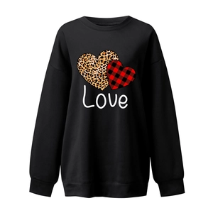 Detail of the heart-shaped leopard and plaid prints with Love text on black sweatshirt