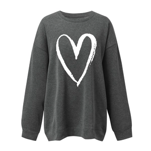 Detail of oversized charcoal gray sweatshirt with a white brushstroke heart print