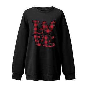 Close-up of red and black buffalo plaid LOVE heart print on women's loose sweatshirt