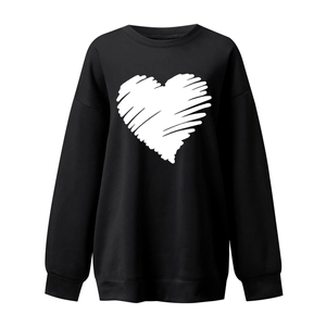 Detail of white graffiti heart print on black oversized crewneck sweatshirt for women