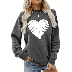 Close-up of heart print on dark grey crewneck sweatshirt with ribbed cuffs