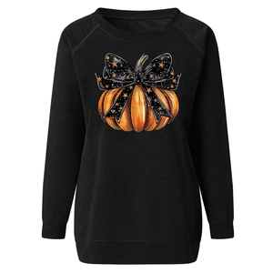 Detail of Halloween pumpkin print on black crewneck sweatshirt with ribbed cuffs