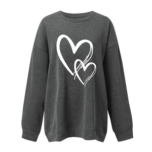 Detail of white double heart doodle print on dark grey crewneck sweatshirt fabric