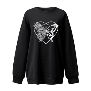 Detail of white butterfly heart print on black crewneck sweatshirt with ribbed cuffs