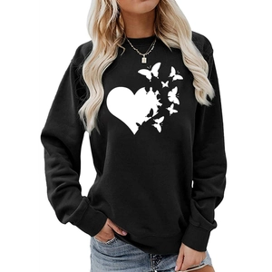 Detail of white heart and butterfly print on black loose fit long sleeve sweatshirt