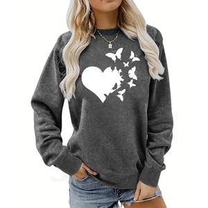 Detailed close-up of soft grey cotton sweatshirt featuring white heart and butterfly print
