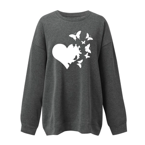 Detail of white heart and butterfly print on charcoal grey loose cotton sweatshirt