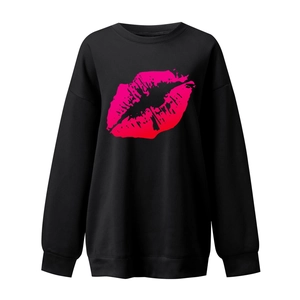 Close-up of vibrant pink gradient lip print on black crewneck sweatshirt fabric