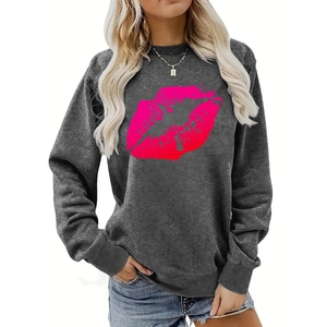Detail of pink lip print on dark grey crewneck sweatshirt with drop shoulder sleeves