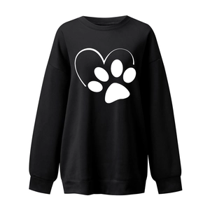 Detail of heart and paw print graphic on loose black crewneck sweatshirt with ribbed cuffs