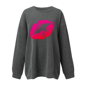 Close-up of charcoal oversized sweatshirt with pink gradient lip print and ribbed cuffs