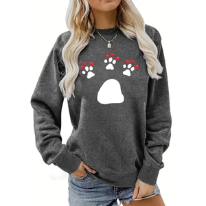 Detail of white paw print with red hearts on dark gray loose long-sleeve sweatshirt