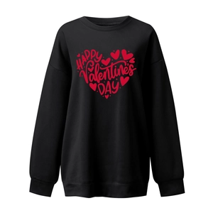 Detailed view of red heart graphic and Valentine's Day print on black sweatshirt
