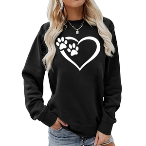 Close-up of black oversized sweatshirt with white heart and paw print graphic design
