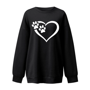 Detail of loose fit crewneck sweatshirt with heart and pet paw print on black fabric
